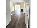 Bright, open living space featuring hardwood floors and a fireplace at 4333 Oakwood Circle, Little River, SC 29566
