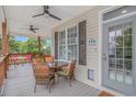 Inviting covered porch with comfortable seating, perfect for outdoor relaxation and enjoyment at 4600 Murrells Inlet Rd., Murrells Inlet, SC 29576