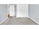 Spacious carpeted bedroom with white trim, closet, and fresh paint at 4840 Moss Creek Loop # 38, Murrells Inlet, SC 29576