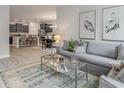 Open concept living area with stylish furnishings and view of kitchen with breakfast bar at 501 Haven View Way, Murrells Inlet, SC 29576