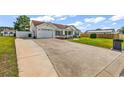 Single-story home with an attached garage and well-kept lawn at 5031 Medieval Dr., Conway, SC 29526