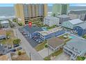 Aerial view of the condo, highlighting proximity to the beach, parking, and nearby amenities at 5409 N Ocean Blvd. # 100, North Myrtle Beach, SC 29582