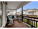 Cozy covered porch with comfortable seating, offering a relaxing outdoor space with views of the neighborhood at 6001-1453 S Kings Hwy., Myrtle Beach, SC 29575