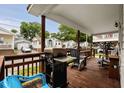 Inviting covered porch with outdoor seating, grill, and lovely views of the surrounding community at 6001-1453 S Kings Hwy., Myrtle Beach, SC 29575