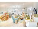 Inviting living room featuring vaulted ceilings, coastal decor, and seamless flow to the kitchen, great room concept at 631 Rycola Circle, Surfside Beach, SC 29575