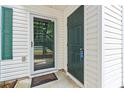 Exterior door with glass storm door entry to condo, next to the painted front door at 820 Fairway Dr. # 1502Hh, Longs, SC 29568
