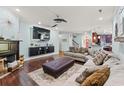 Spacious living room featuring a stylish fireplace, tv, and open floor plan at 1051 Academy Dr., Conway, SC 29526