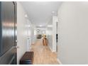Inviting foyer featuring hardwood floors, neutral paint, and a bench seat at 125 Foxford Dr., Conway, SC 29526
