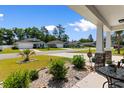 View of a quiet neighborhood street with well-maintained lawns and sidewalks at 125 Foxford Dr., Conway, SC 29526