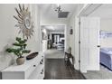 Inviting entryway with tile floors, stylish decor, and view into a living space with modern furnishings at 1305 Forest View Rd., Conway, SC 29526