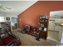 Cozy living room featuring a vintage TV and easy access to an ample kitchen at 134 Butkus Dr. # 7, Myrtle Beach, SC 29588