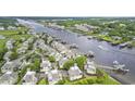 A scenic aerial view of waterway community with waterfront homes and docks at 1501 Harbor Dr., North Myrtle Beach, SC 29582