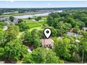 Aerial view of a beautiful neighborhood with manicured greenery, with a river in the background at 1501 Harbor Dr., North Myrtle Beach, SC 29582