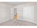 Carpeted bedroom with adjoining walk-in closet and a double door, creating a serene space at 1567 Breakwater Dr., Little River, SC 29566