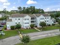 A well-maintained apartment complex with manicured landscaping and visible parking at 2280 Andover Dr. # C, Surfside Beach, SC 29575