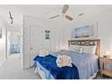 A bright bedroom featuring a comfortable bed with blue bedding and coastal decor for a relaxing stay at 2710 S Ocean Blvd. # 402, Myrtle Beach, SC 29577