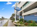 The Avista Resort sign on the main road with beautiful landscaping and a view of the fitness center at 300 N Ocean Blvd. # 122, North Myrtle Beach, SC 29582