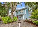 Charming two-story home with a bird bath surrounded by well-maintained landscaping and mature trees at 308 76Th Ave. N # 5, Myrtle Beach, SC 29572