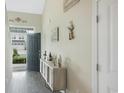 Welcoming foyer featuring hardwood floors, neutral walls, and stylish decor at 312 Goldenrod Circle, Little River, SC 29566
