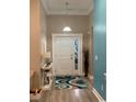 Bright entryway with tiled floor, decorative rug, and white trim at 387 Blue Rock Dr., Longs, SC 29568