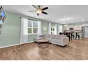 Inviting living area featuring an open layout seamlessly connecting to a modern kitchen and dining space at 408 Carmello Circle, Conway, SC 29526