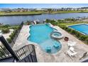 Aerial view of backyard oasis featuring an in-ground pool, jacuzzi, plenty of patio space and a river view at 433 Saint Julian Ln., Myrtle Beach, SC 29579