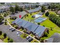 Aerial view of condos with a community pool, tennis court, and easy access to the marina at 4648 Lightkeepers Way # 39A, Little River, SC 29566