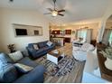 Open floor plan featuring a stylish living room, modern kitchen, and adjacent dining area at 541 Irees Way, Longs, SC 29568
