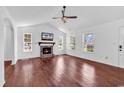 Spacious living room showcasing hardwood floors, fireplace and bright natural light at 553 Fox Chase Dr., Conway, SC 29527