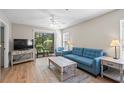 Inviting living room boasts wood-style floors, comfortable seating, and access to an outdoor patio at 562 Blue Stem Dr. # 54-F, Pawleys Island, SC 29585