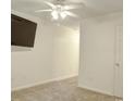 Bright bedroom with neutral carpet, a ceiling fan, and space for personalized decor at 601 Putters Ln. # H209, Little River, SC 29566