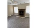 Spacious living room with a brick fireplace and neutral carpet at 615 Todd Blvd., Conway, SC 29526