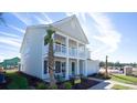 Inviting two-story home boasting a lovely double porch and manicured landscaping at 7127 Shooting Star Way, Myrtle Beach, SC 29579