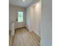 Bright entryway featuring wood-look floors and a front door with glass panels at 7611 Coteswood Dr., Myrtle Beach, SC 29572