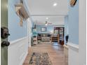 Living room with coastal decor, comfortable seating, and access to outdoor balcony at 9661 Shore Dr. # B7-29, Myrtle Beach, SC 29572