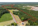 Expansive acreage showcasing property boundaries, mature trees, lush pastures, and a blend of natural beauty, and construction sites at 971 Mcnabb Rd., Loris, SC 29569