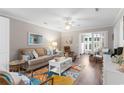 Cozy living room featuring stylish furniture, a colorful rug, and plenty of natural light at 9776 Leyland Dr. # 2, Myrtle Beach, SC 29572