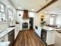 Modern kitchen with marble countertops, a stainless steel oven, and a stylish island with wine storage at 124 Orange St., Georgetown, SC 29440