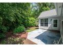 Private backyard featuring a stone patio perfect for entertaining and relaxing at 161 Patriot Ln., Pawleys Island, SC 29585