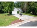 Charming single-story home featuring a well-manicured lawn and an inviting driveway at 161 Patriot Ln., Pawleys Island, SC 29585