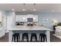 Bright kitchen featuring a granite island, white cabinetry, and stainless steel appliances at 170 Bantry Ln., Conway, SC 29526