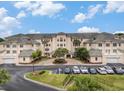 Inviting condo complex with meticulously landscaped grounds, ample parking, and lovely green tile roof at 2180 Waterview Dr. # 1036, North Myrtle Beach, SC 29582