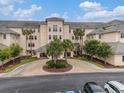 Beautiful condo complex with meticulous landscaping, lush greenery, and well-maintained parking area at 2180 Waterview Dr. # 1036, North Myrtle Beach, SC 29582