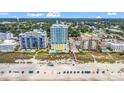 Beachfront condo featuring a pristine beach, community pool, and lush landscaping for relaxed coastal living at 2301 S Ocean Blvd. # 1405, North Myrtle Beach, SC 29582