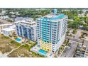 Aerial view of a high rise condo building and pool with city and beach views at 2301 S Ocean Blvd. # 1405, North Myrtle Beach, SC 29582