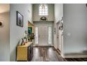 Bright foyer featuring high ceilings, decorative accents, and wood flooring at 2461 Summerhaven Loop, Conway, SC 29527