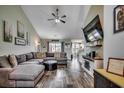 Comfortable living room with vaulted ceiling, stylish sectional, and contemporary decor at 2461 Summerhaven Loop, Conway, SC 29527