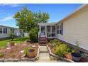 Charming home features a lovely screened porch entry and beautiful flower beds, enhancing its appeal at 259 Iroquis Trail, Longs, SC 29568