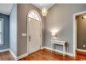 Inviting entryway features hardwood floors and an arched front door at 303 Ayrie Ct., Conway, SC 29527