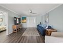 Cozy living room with plush seating, a ceiling fan, and stylish decor accents at 312 35Th Ave. N, North Myrtle Beach, SC 29582